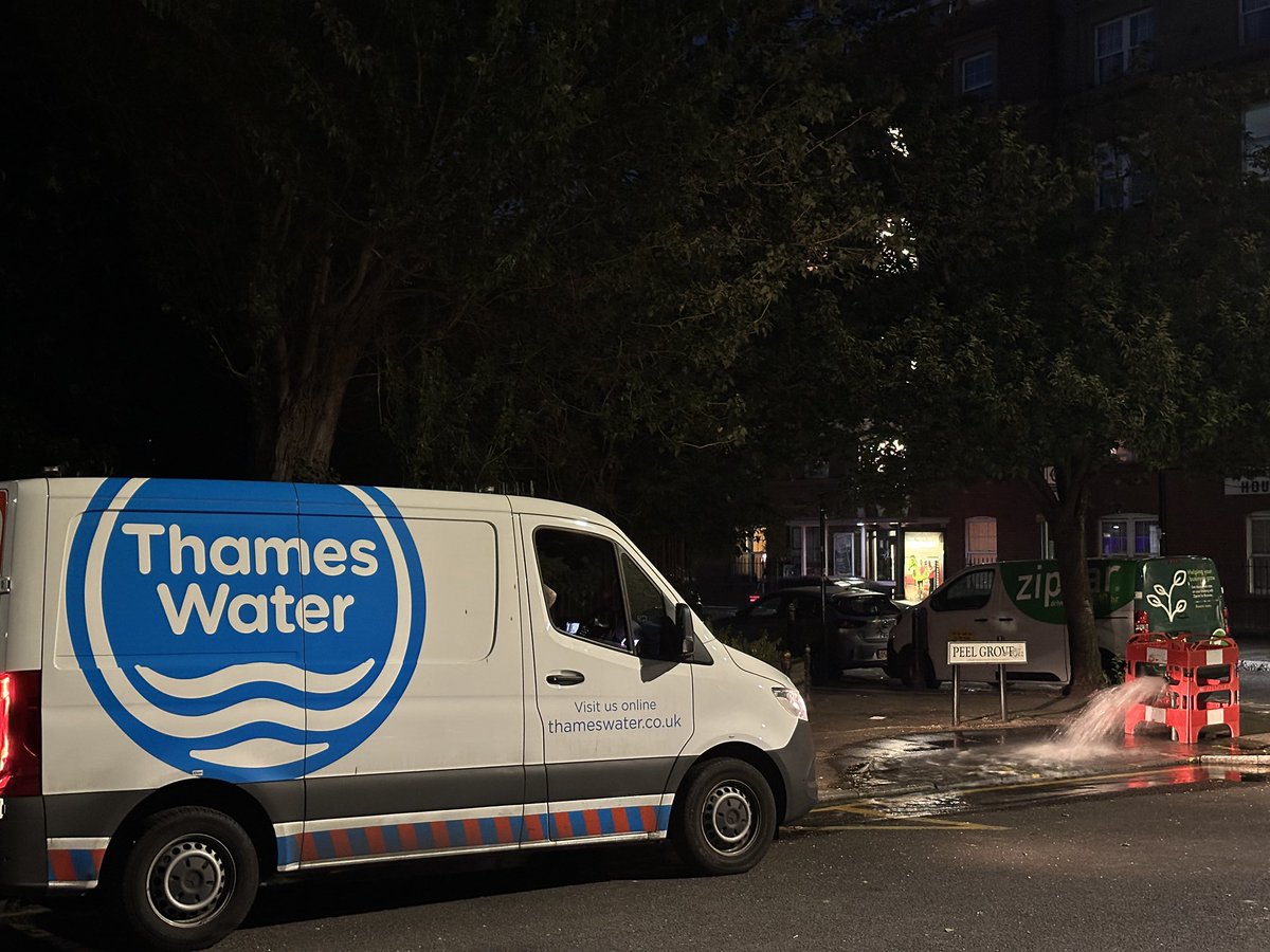This encapsulates Thames Water perfectly. Man in van employed to watch water gushing out of a hole down the drain.