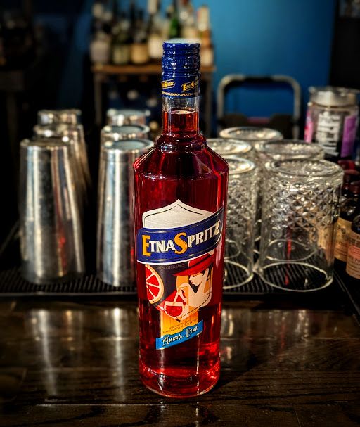Tomorrow's Free Tasting 5-7pm at Mitch e Amaro:

Etna Spritz

Byron Kimmerly will be in store pouring samples and answering questions about this incredible spirit, and we'll feature Etna Spritzes at the bar all night. Cheers!