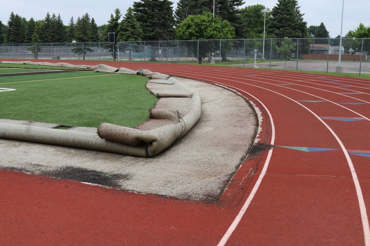 The South High School track is being replaced this summer. Last week, a crew pulled the football field turf back away from the track so that they could begin work on the new track.