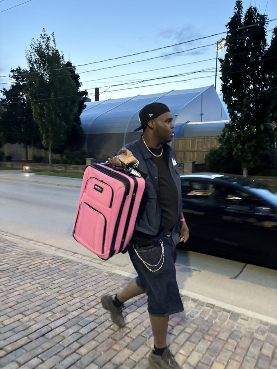 just a 7ft boy with a pink purse