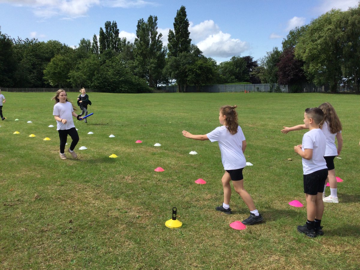 In PE, the year 3 children have been improving their relay skills by making sure they are positioning their bodies and hands ready to take the baton from their team mates.