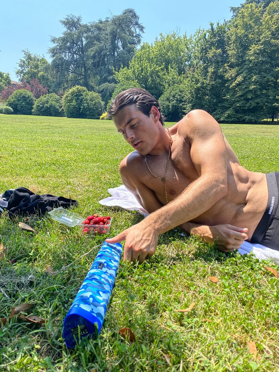 Aiden St. John on Summer Eve — bare-chested in sun-drenched greenery, savoring cherries like stolen kisses from the season. Juicy, wild, and unapologetically free. 🍒🌿