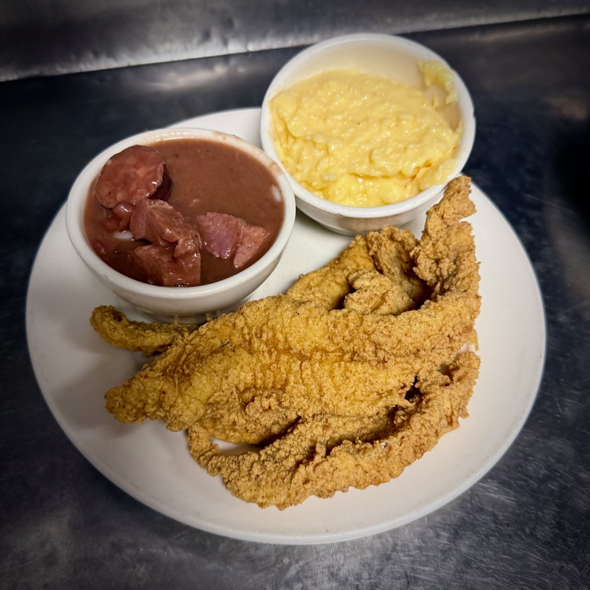 Fried catfish plate with red beans &amp; rice plus cheese grits. Just add a cold beer! 🍽️ Dine-in 📲 bit.ly/order-ubereats App: <a href="/UberEats/">Uber Eats</a> 🇺🇸🇨🇦 Shipping <a href="/goldbelly/">Goldbelly 🚀</a> bit.ly/mthrgbly ☀️Open 7am-10pm daily 🎁Gifts INFO linktr.ee/mothersrestaur… #mothersrestaurant