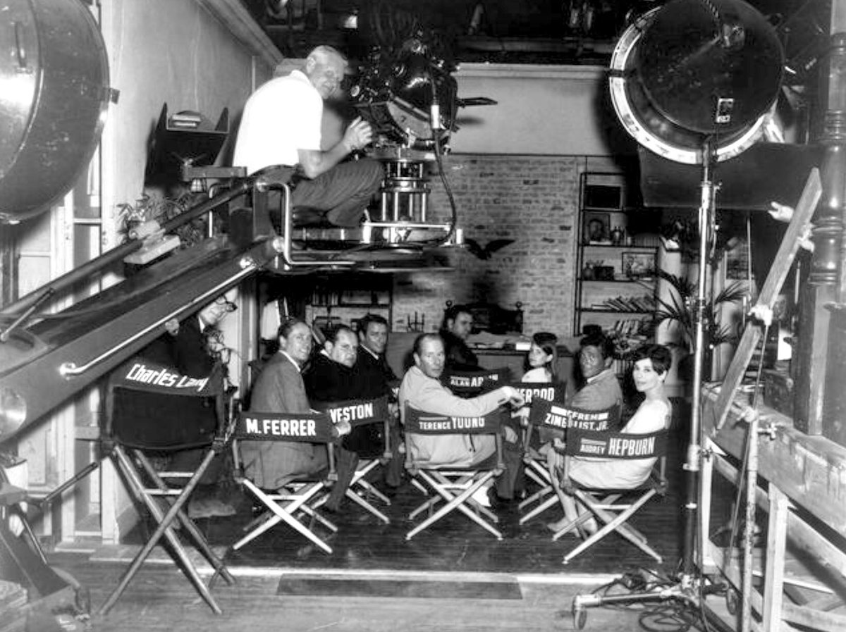 #TerenceYoung on the set of "WAIT UNTIL DARK" (1967) with D.o.P. Charles Lang, cameraman George Gordon Nogle, producer Mel Ferrer and cast Jack Weston, Richard Crenna, Alan Arkin, Efrem Zimbalist Jr., Audrey Hepburn &amp; young Julie Herrod who quite rightly had her own named chair!