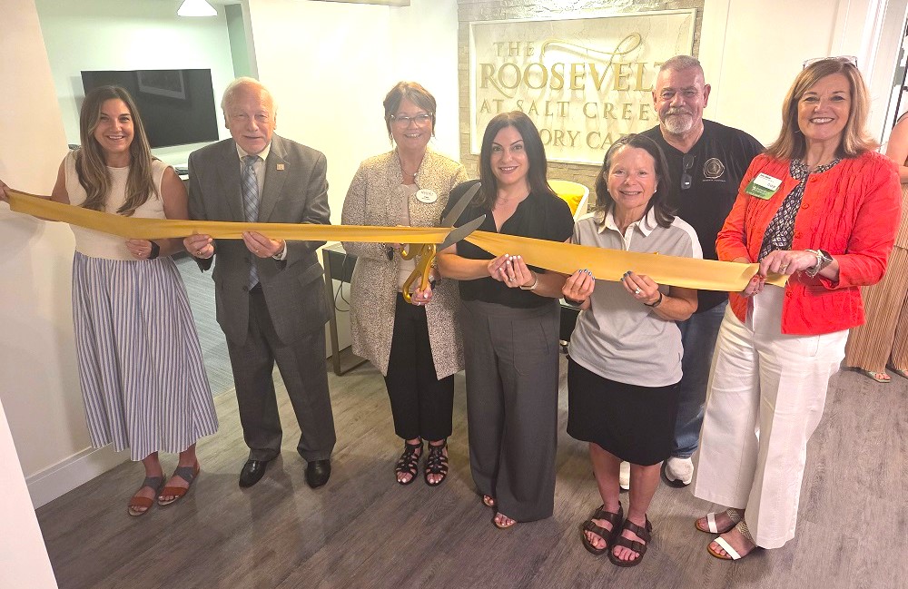 Chamber Ambassadors join The Roosevelt at Salt Creek Executive Director Tam Wagner at today's Grand Opening of the senior living facility's Timeless Memory Care wing in southwest Elmhurst.