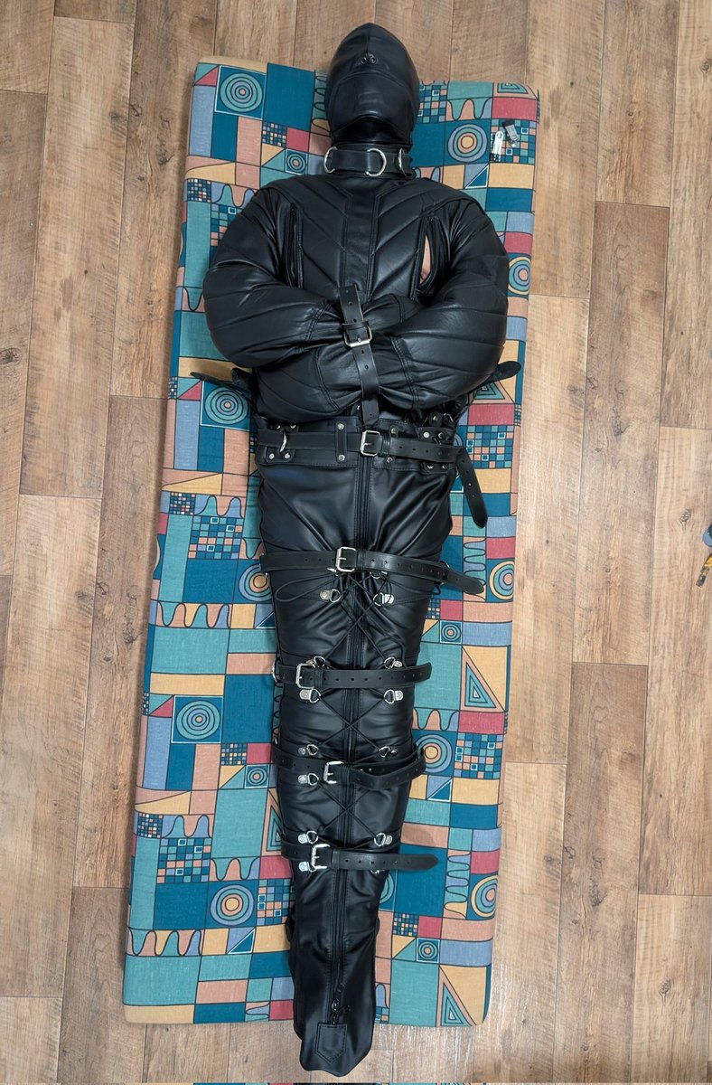 My slave property <a href="/BondageslaveDE/">BondageslaveDE 🏳️‍🌈 🔜 Easter Berlin</a> locked in Carrara steel chastity, leather straitjacket, leather leg-sack, leather hood and gagged. Enjoy your evening!