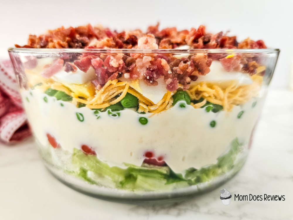 The beauty of the 7-layer salad lies in its versatility. It’s a complete meal in itself, with layers of crunchy lettuce, juicy tomatoes, protein-packed eggs and bacon! Get the Recipe here: bit.ly/4iuKAz5
