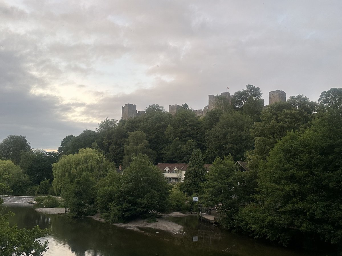 Ludlow Castle peaking out from behind the trees as the sun begins to set #castle #ludlowcastle #medieval #medievalcastle