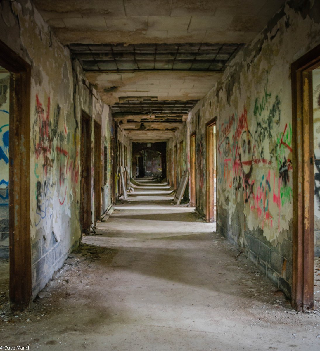 One of the eerie hallways of the long-abandoned Saratoga County Homestead in East Galway, NY.  

The Homestead as it's called, opened in 1914 as a tuberculosis sanatorium, treating patients until its closing in 1960. A year later, the facility reopened as a nursing home,