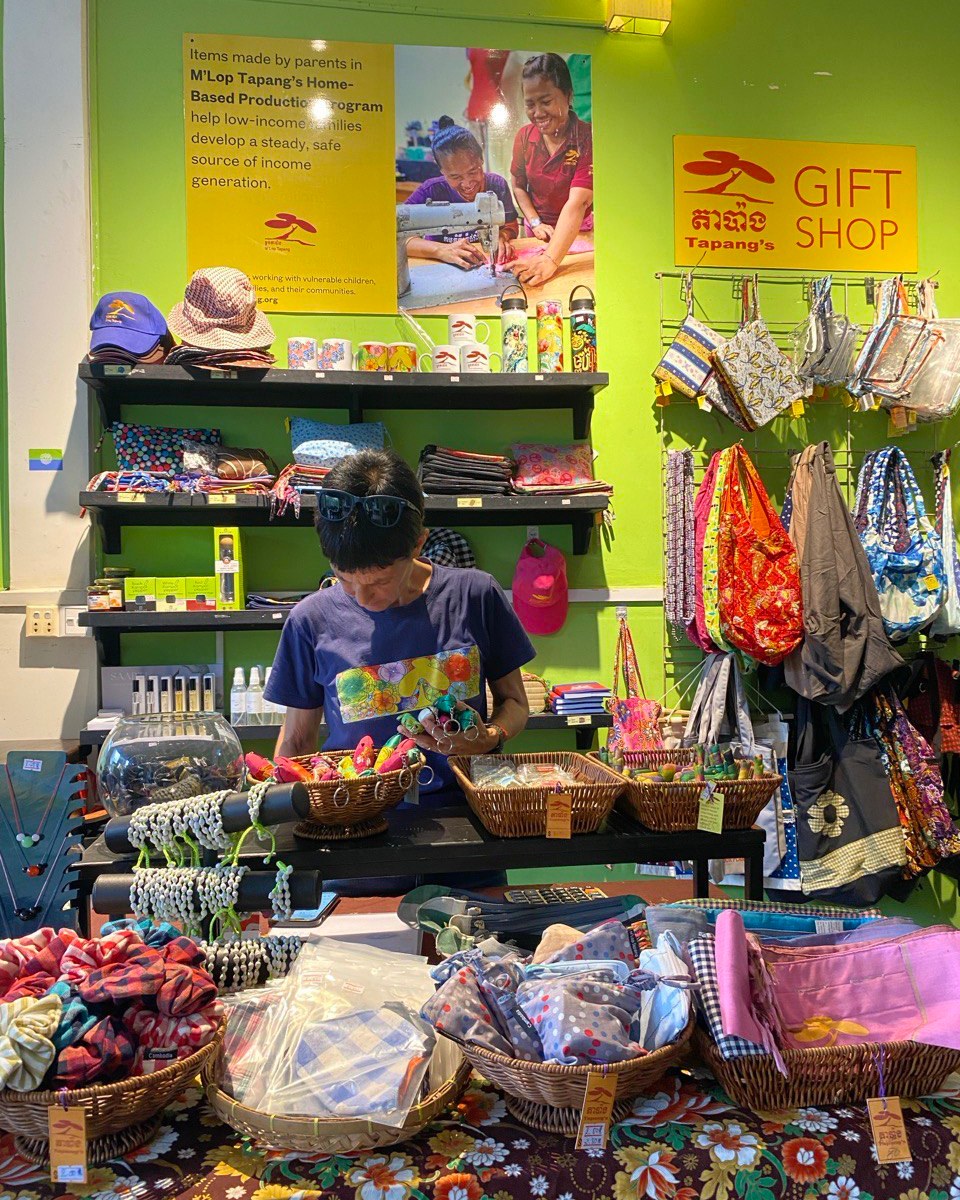 Did you know we have a small shop inside our vocational training restaurant, Sandan?
It’s filled with handmade items—shirts, trinkets, and gifts—created by mothers in our Home-Based Production Program.