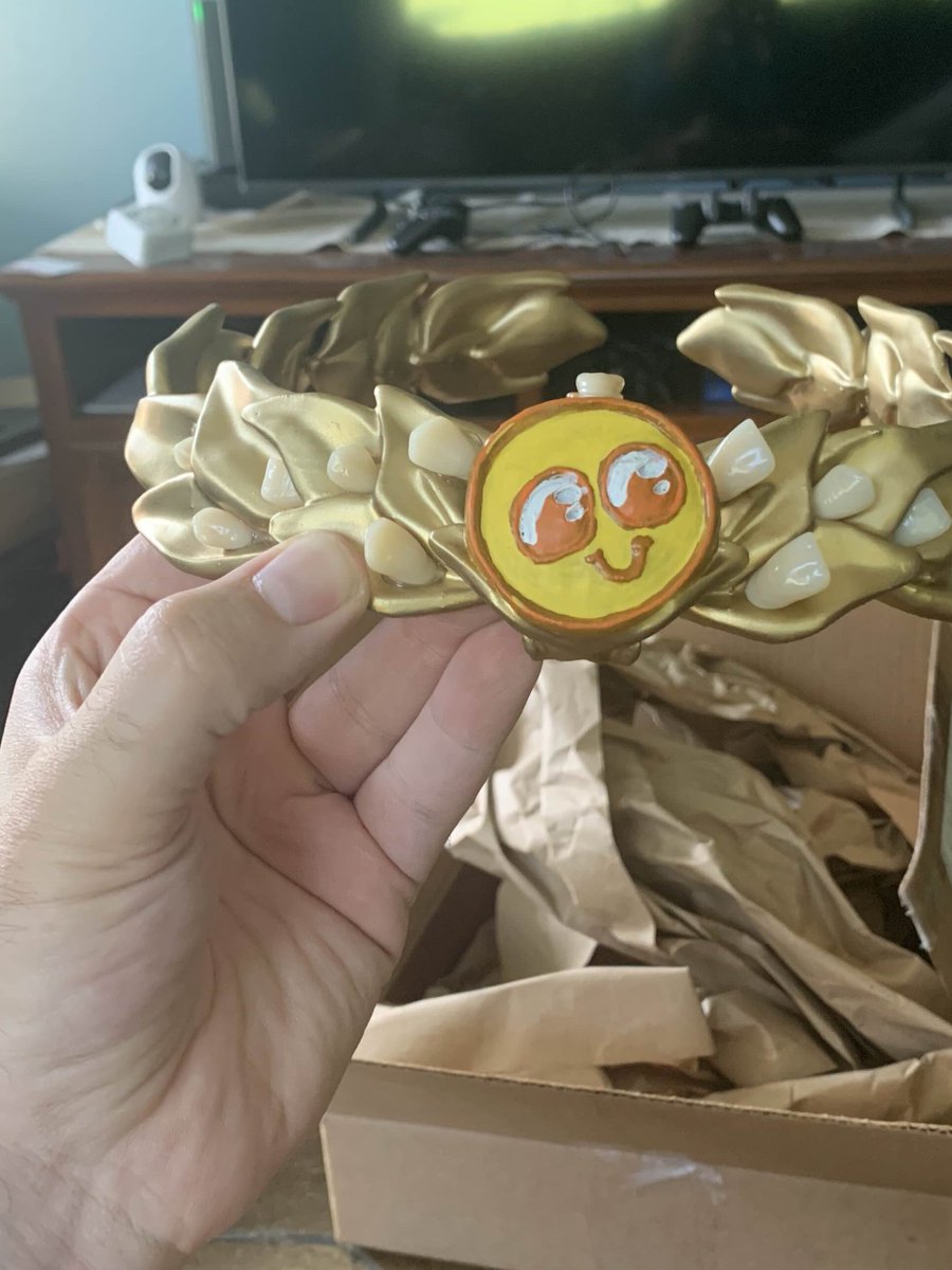 The promised "teeth crown" in the hands of the winner of the 2023 Vid Somewhere! Years were spent not mailing it, but it was actually real and the threats to give this as a reward have finally been realized. Thanks to Twobit for making and shipping the thing!
