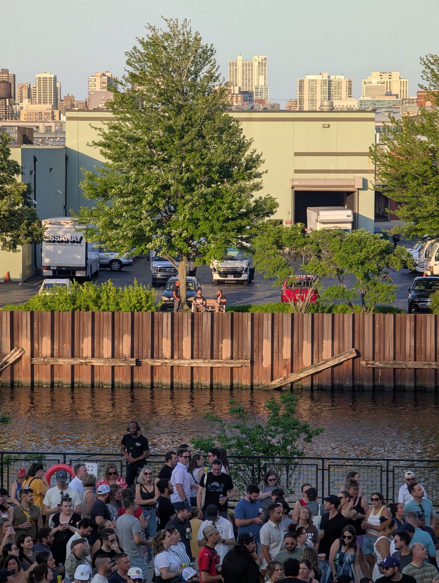 The Salt Shed secret for sold-out shows outdoors is to claim the park bench in the parking lot across the river: unobstructed view, perfect breeze, and free