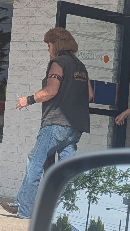 2LiterDutch's tweet photo. I wish I'd been able to get a better shot without getting my ass kicked.... But today I got photographic evidence of the original patient zero mullet. So committed he got a mullet toupe and put it over top of the remnants of the OG. His mustache smells like everybody's Aunt. https://t.co/6bmkoPwdqj