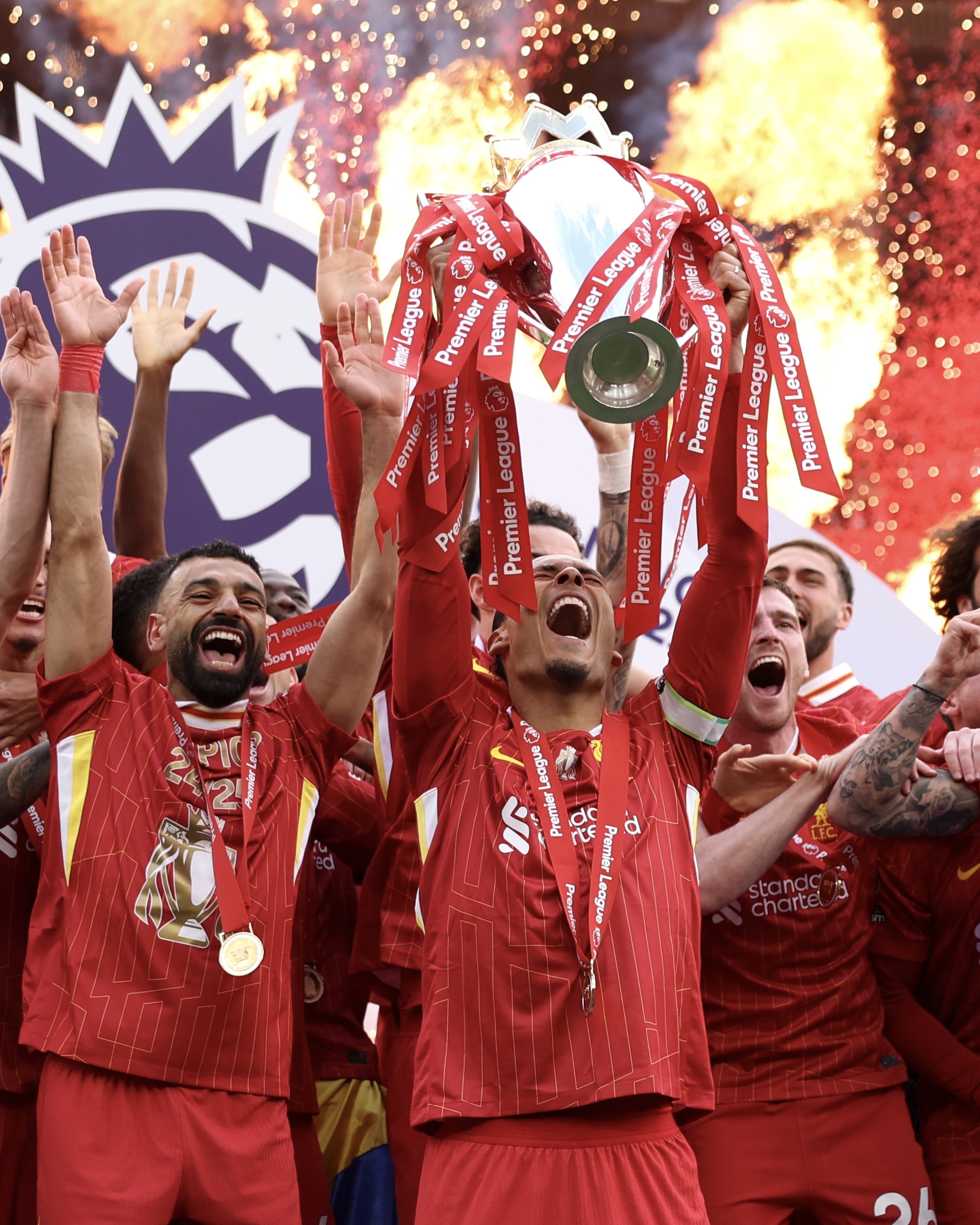 Virgil van Dijk lifts the Premier League trophy.