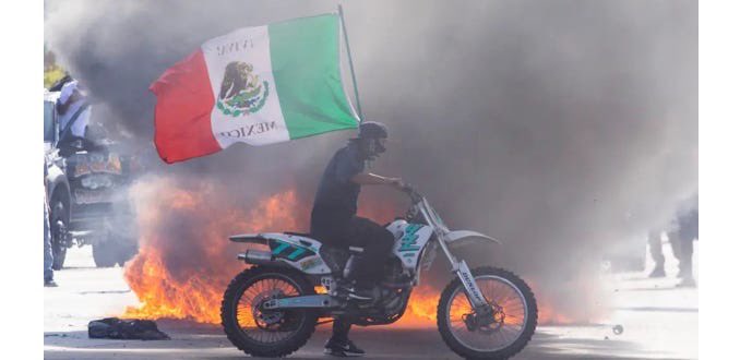 BOLDTactical's tweet photo. If your homeland is a flaming trash pile worth fleeing, maybe don’t wave its flag like a tailgate banner while you riot to avoid going back. 
It sends mixed signals. https://t.co/RHCyCS2NWJ