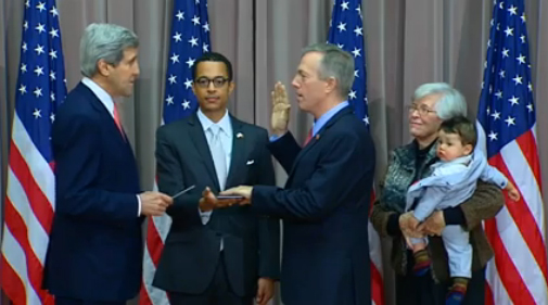 📸 "Swearing-in, Washington DC, 2014. Secretary Kerry, Clayton Bond, Ted Osius, TABO in the arms of his grandmother.”