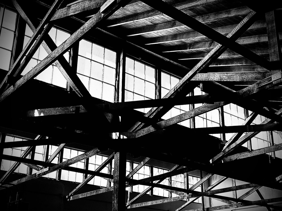 I took this photo in a warehouse that used to be a citrus processing facility. Cool interplay of light and shapes.