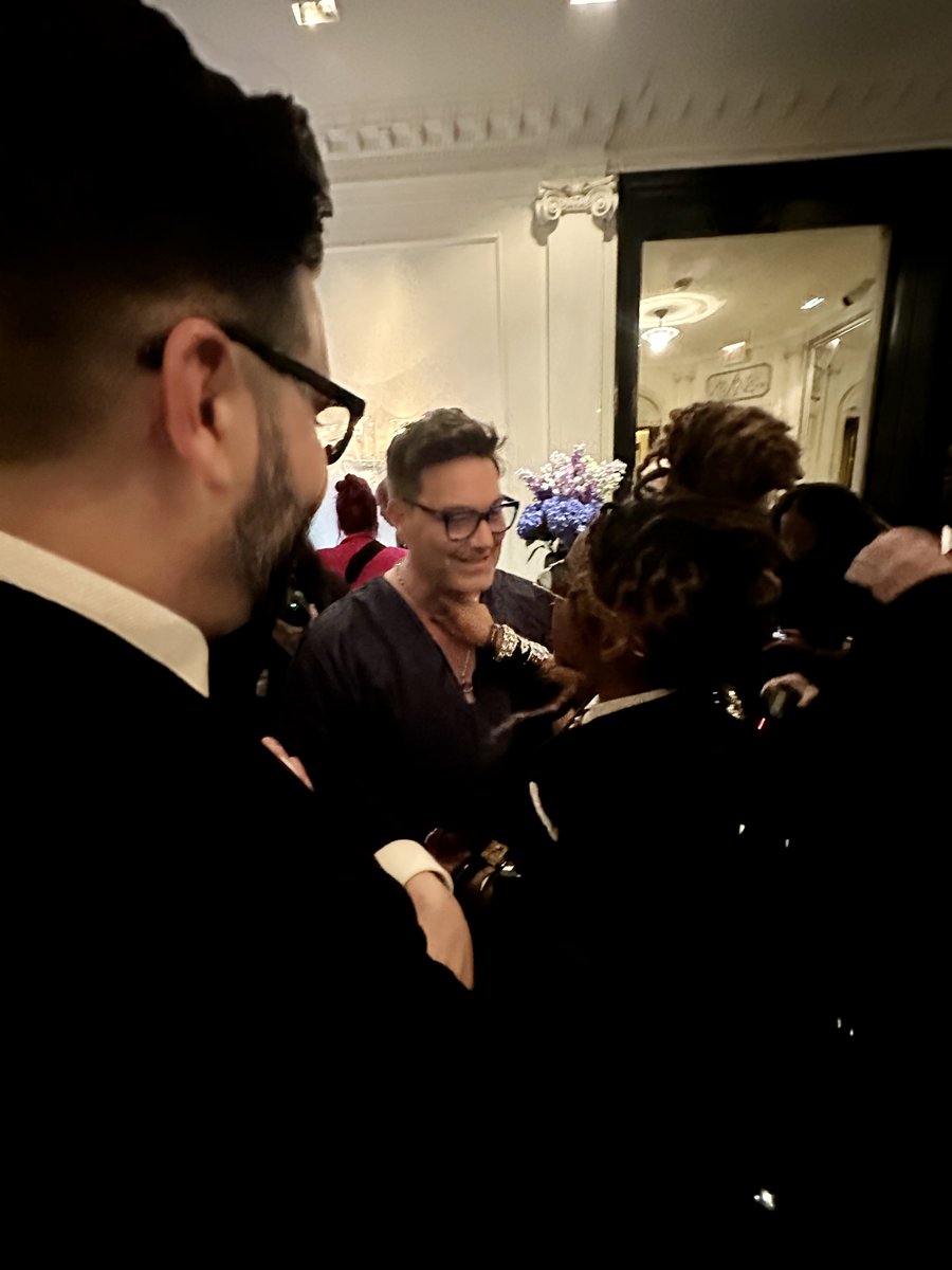 Kara Young adjusting my necklace for me last night.