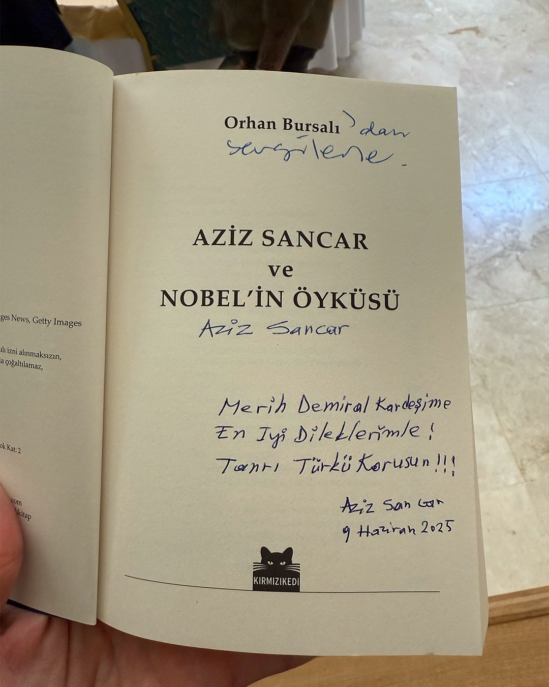 Aziz Sancar gifts Merih Demiral a signed copy of The Story of Aziz Sancar and the Nobel with message: 'To my brother Merih Demiral, with best wishes; May God protect Turks. Aziz Sancar, June 9, 2025.' (@Merihdemiral via X)