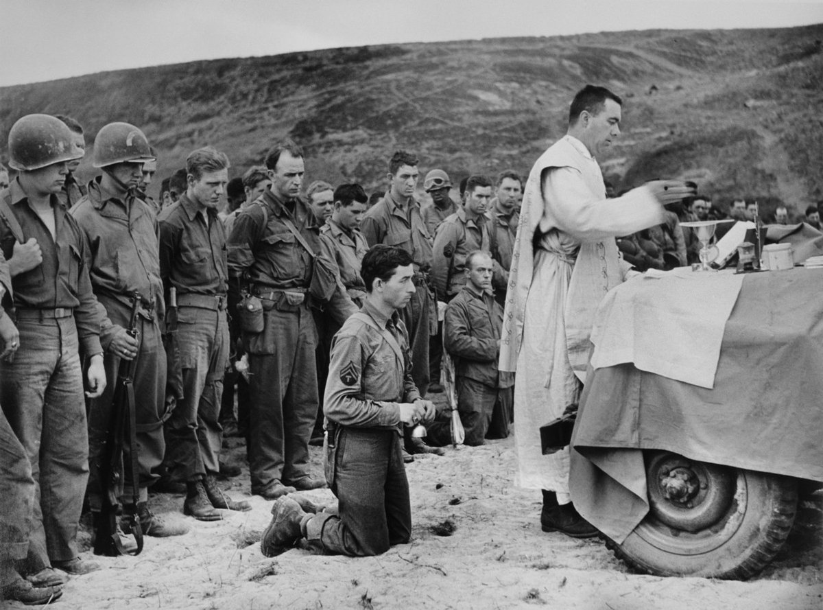 kershaw_alex's tweet image. Prayers for the fallen, on Omaha Beach. By the great Robert Capa.