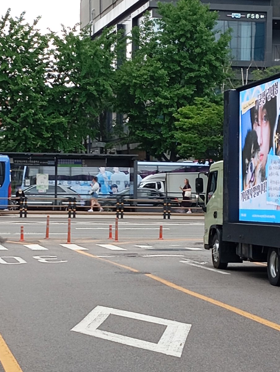 BTS_Zimbabwe's tweet photo. Lots of trucks and buses around. Sticking to my spot for now. Lots of police presence for crowd control as more of us arrive. Admin in the cap if you want to say hi. #BTSFESTA2025 #btsisback
#RMisBack
#VisBack https://t.co/4aKaSUITkZ