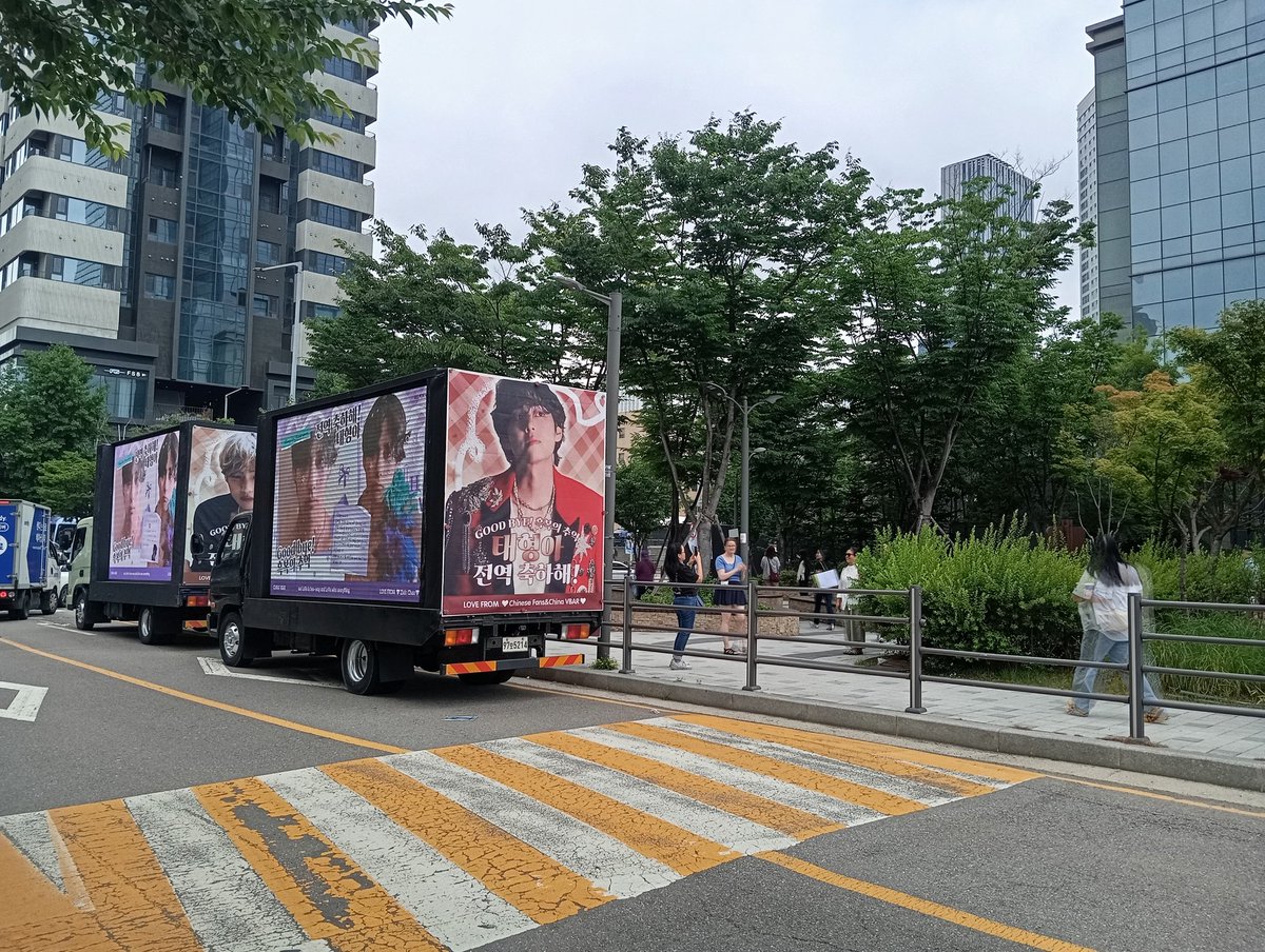 BTS_Zimbabwe's tweet photo. Lots of trucks and buses around. Sticking to my spot for now. Lots of police presence for crowd control as more of us arrive. Admin in the cap if you want to say hi. #BTSFESTA2025 #btsisback
#RMisBack
#VisBack https://t.co/4aKaSUITkZ