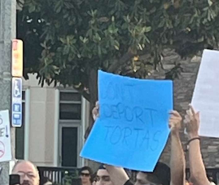 Zoosander's tweet image. At least this guy isn’t afraid to hide his face like the rest of the LA Cowards 🤣🤣🤣 #FunnySign #LosAngelesProtests #Whittier #IceIceBaby