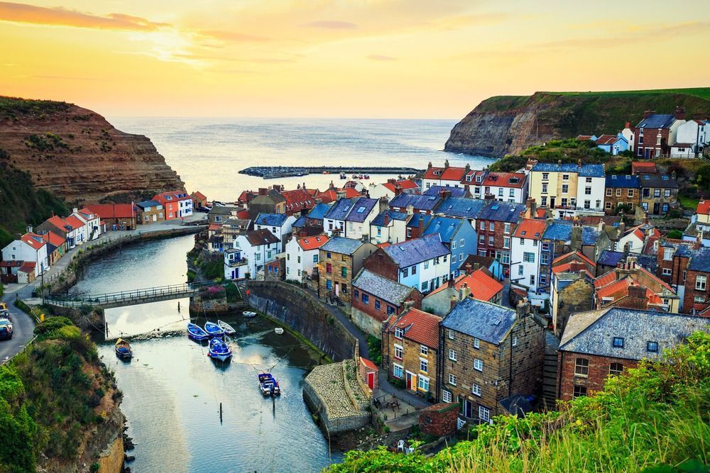 Tucked between rugged cliffs and the North Sea, Staithes in #Yorkshire is a postcard-perfect fishing village with cobbled lanes, colourful cottages, and timeless charm. 

#Staithes #CoastalEscape #UKTravel