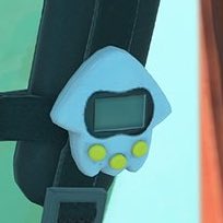 big man has a splatoon tamagotchi