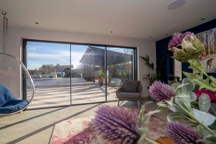 Experience elegance and contemporary aesthetics with our Vision20 sliding doors. Designed to create a seamless connection to the outdoors whilst enhancing your living space with abundant natural light. 
Request a quote today shorturl.at/xCmEX