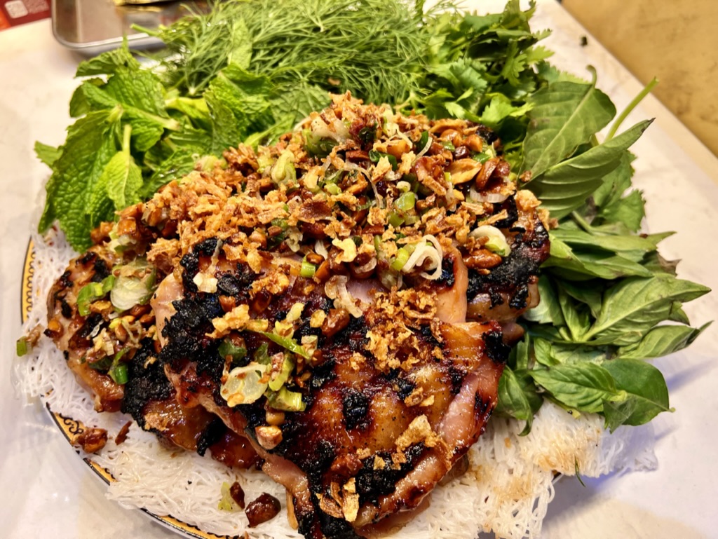 RobertiLax's tweet image. Vietnamese-style BBQ Chicken marinated for 48 hours in fish sauce, sugar, lemongrass, and garlic, topped with sizzled scallions, peanuts, and fried shallots, served on bánh hỏi pressed rice noodles, with a proper herbal shrubbery served by no restaurant east of Garden Grove.