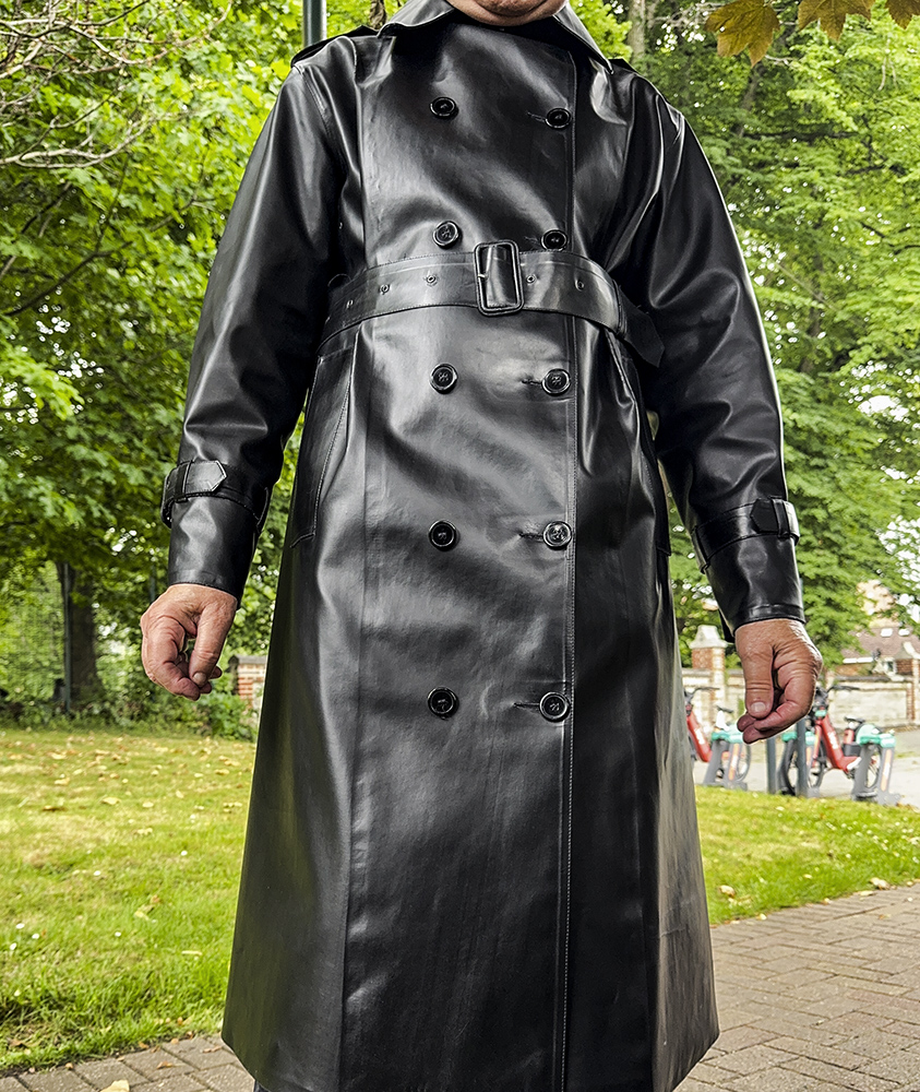 Another summer's day in a rubber mackintosh. 

mackintosh raincoat rubber