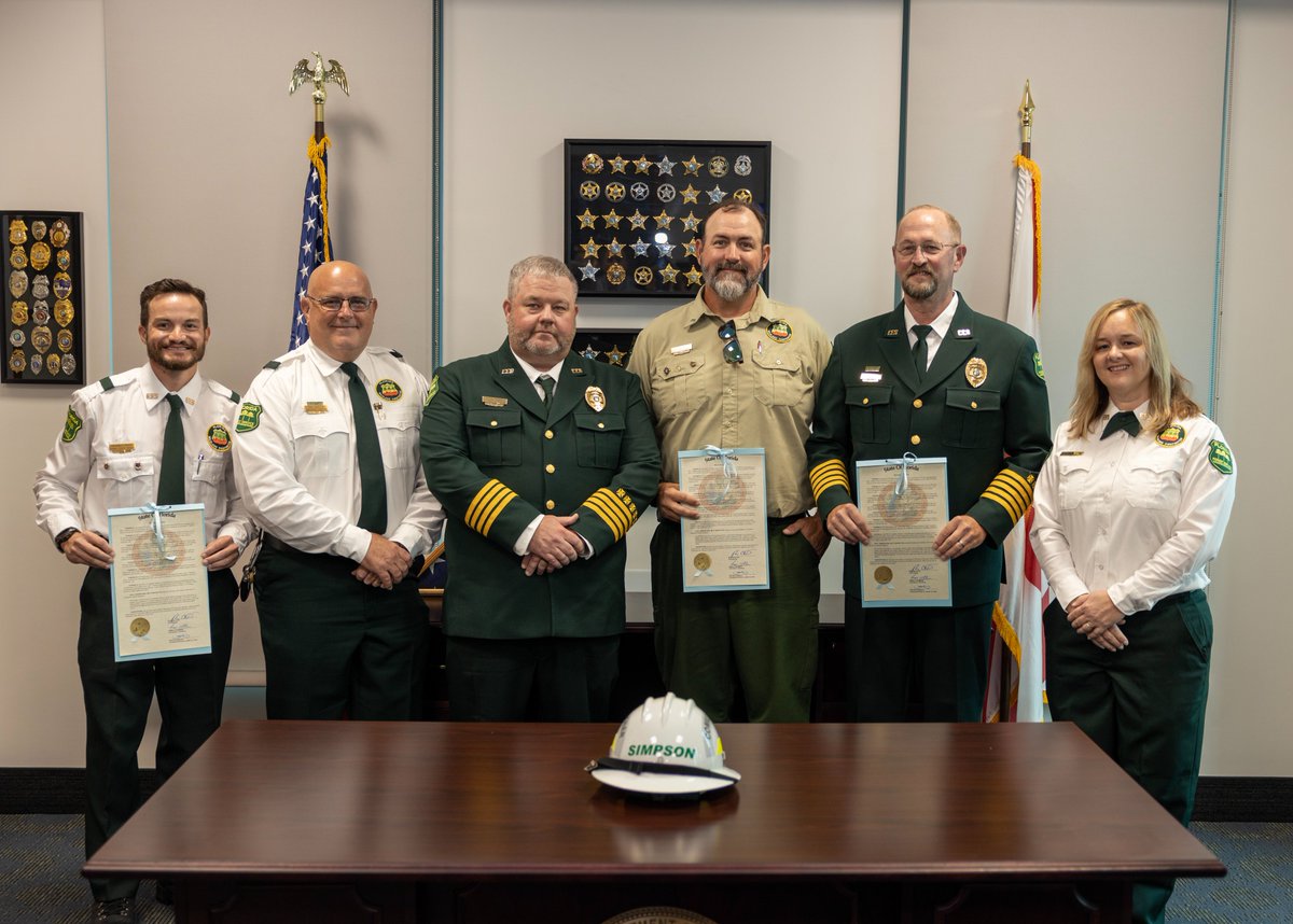 FDACS's tweet image. At today’s meeting of the Governor & Cabinet, Commissioner Wilton Simpson was proud to present a resolution honoring the Florida Forest Service’s Everglades District for their efforts in containing the “344 Fire” in South Florida this past March.