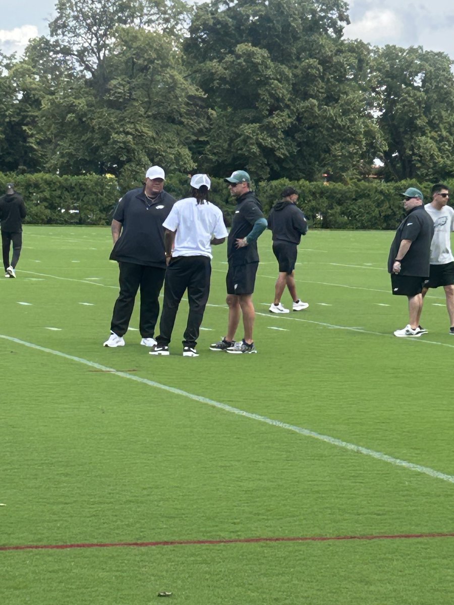Delaware State coach DeSean Jackson talking with Kevin Patullo as #Eagles practice: