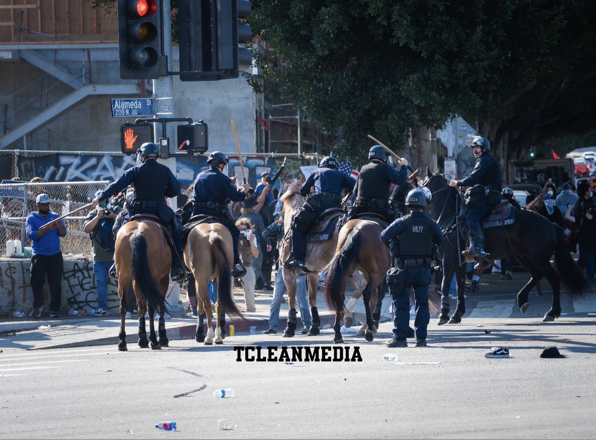 TcleanTv's tweet image. The incident most alarming to me. Horse mounted police run this guy down for crossing the street. As he tried to protect himself from being trampled. The cops start to beat him with the batons for contacting a “police officer” the horse. When they initiated the contact!