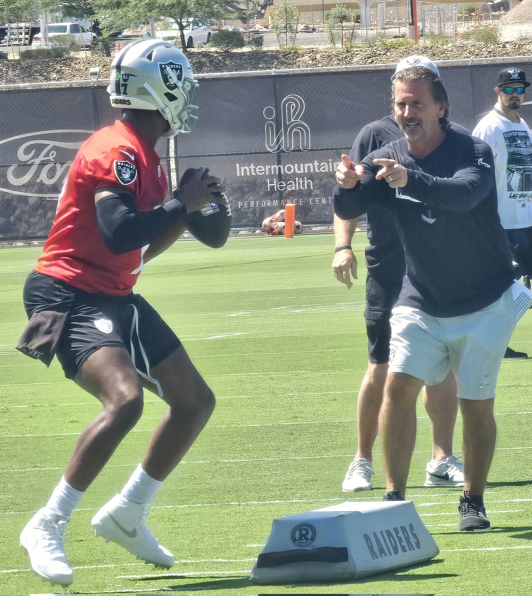 Geno Smith takes some pointers from #Raiders QB coach Greg Olson during minicamp on Tuesday...