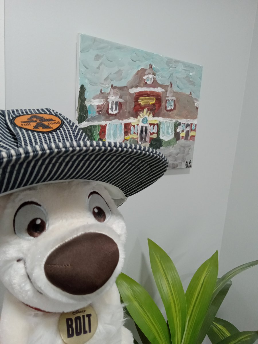 VividGroovy's tweet photo. My #DisneysBolt #plush wearing my new #railroad engineer hat, posing with my art of @B_railway_dog and my painting of a local railway station. #furry #furryart https://t.co/DrLSnL64v0