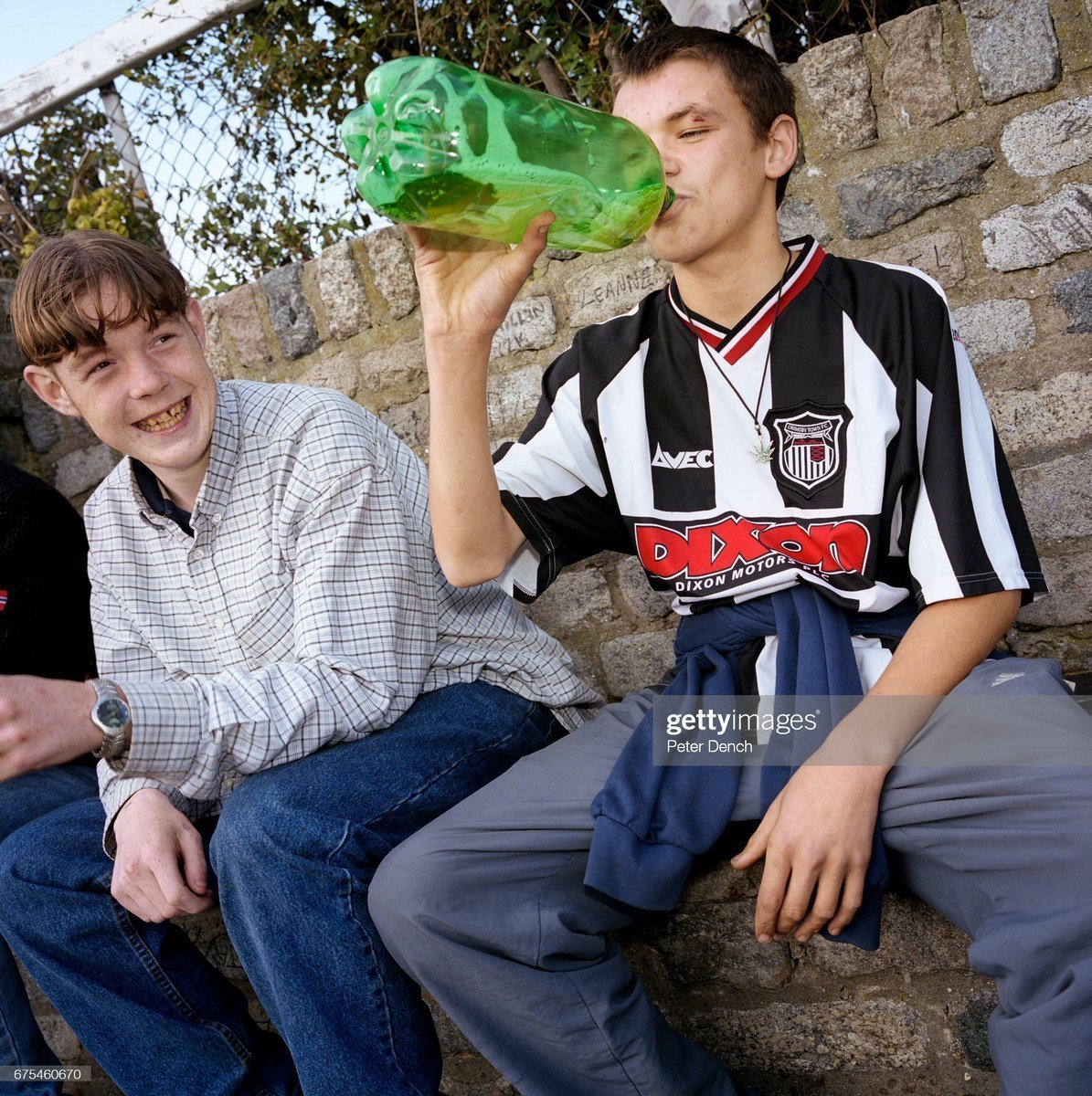 Friends Daniel (left) and Smudge drink cider at Cleethorpes bus station. They are waiting to see if any good-looking girls arrive in town for the day (2001)