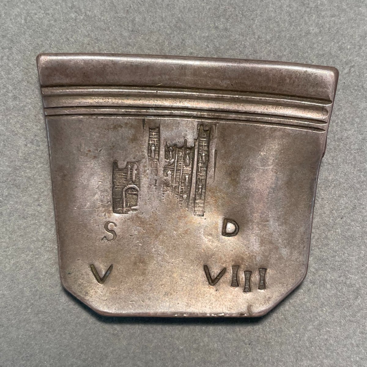 You can still see the original edge of the piece of silver plate that this coin was struck from.