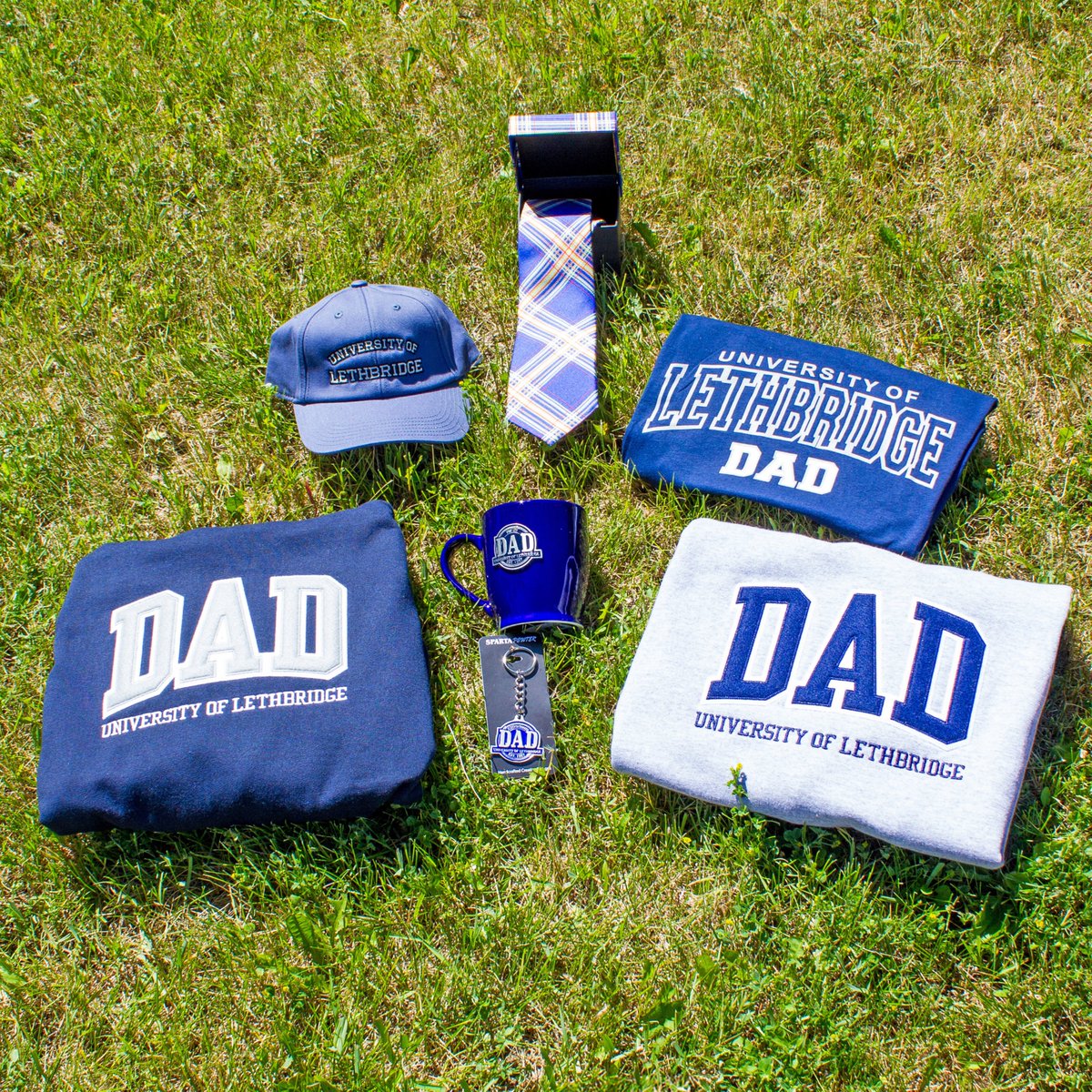 Father’s Day is this Sunday! Celebrate Dad while having him rep your school! 🎓

Shop University of Lethbridge Dad tees, crews, hoodies, mugs, keychains, and more! ✨

Available in-store &amp; online 🛒