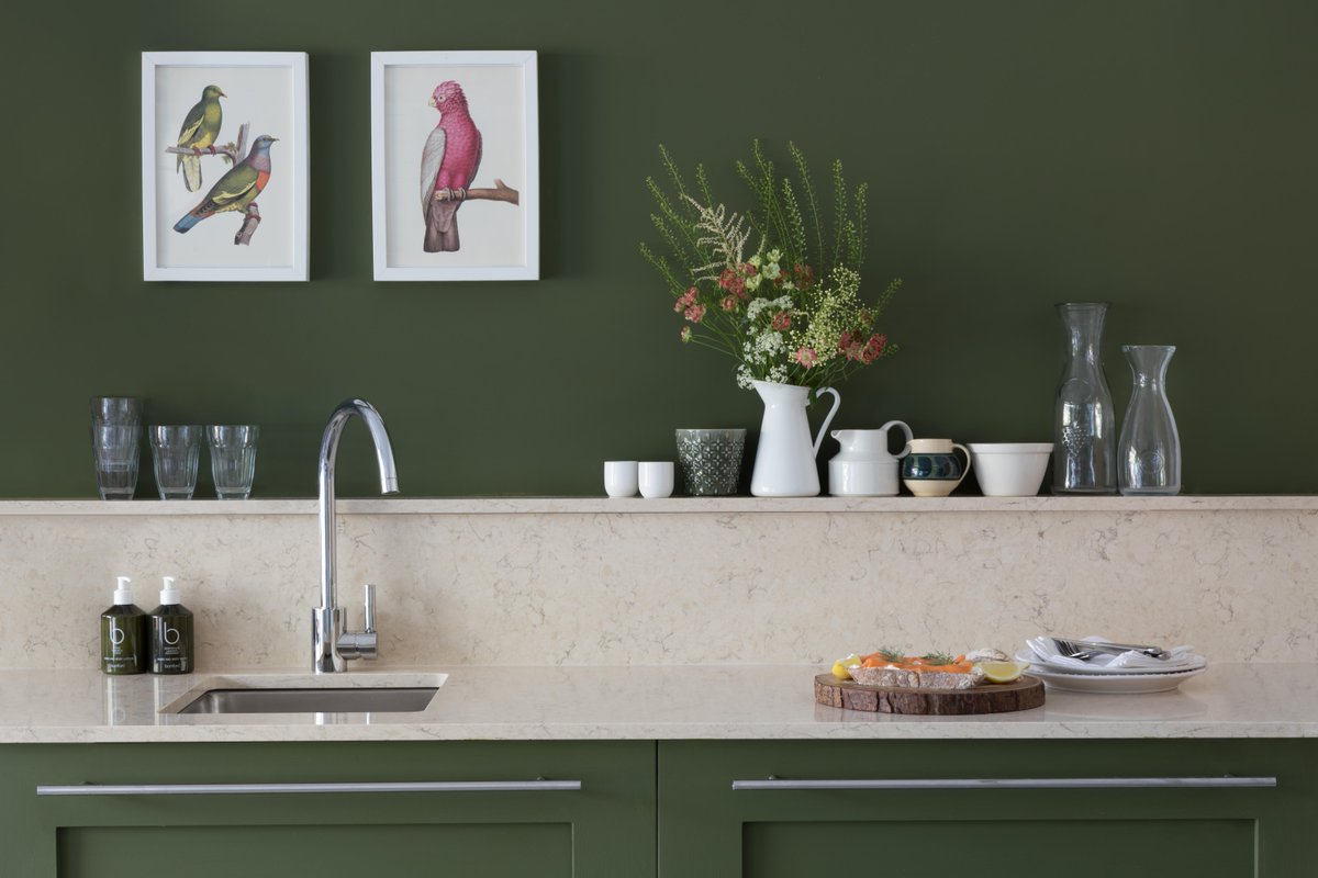 One of the most notable trends taking centre stage in 2025? Green-coloured kitchens. From deep forest hues to soft sage tones, green has become the go-to choice for those wanting a kitchen that feels both vibrant and grounded.

Pictured: CRL Quartz Savannah