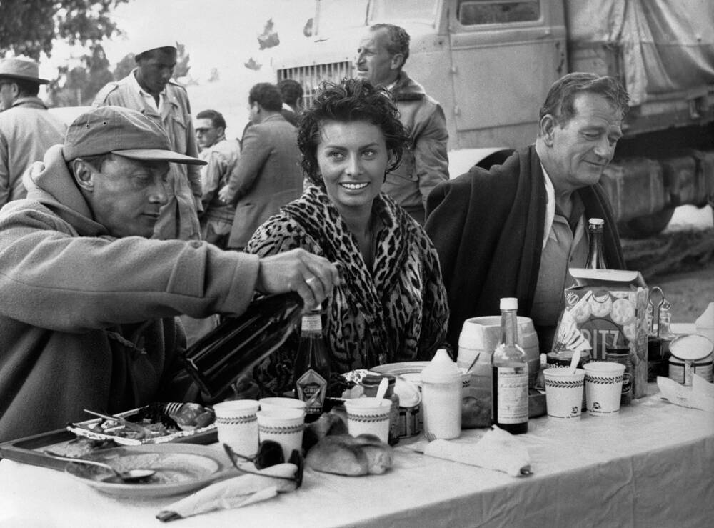 goldenagefilm's tweet photo. Some great #BTS photos from John Wayne’s forgotten 1957 adventure classic, Legend Of The Lost, Co-Starring Sophia Loren and directed by Henry Hathaway. https://t.co/XkfAPBdmDC