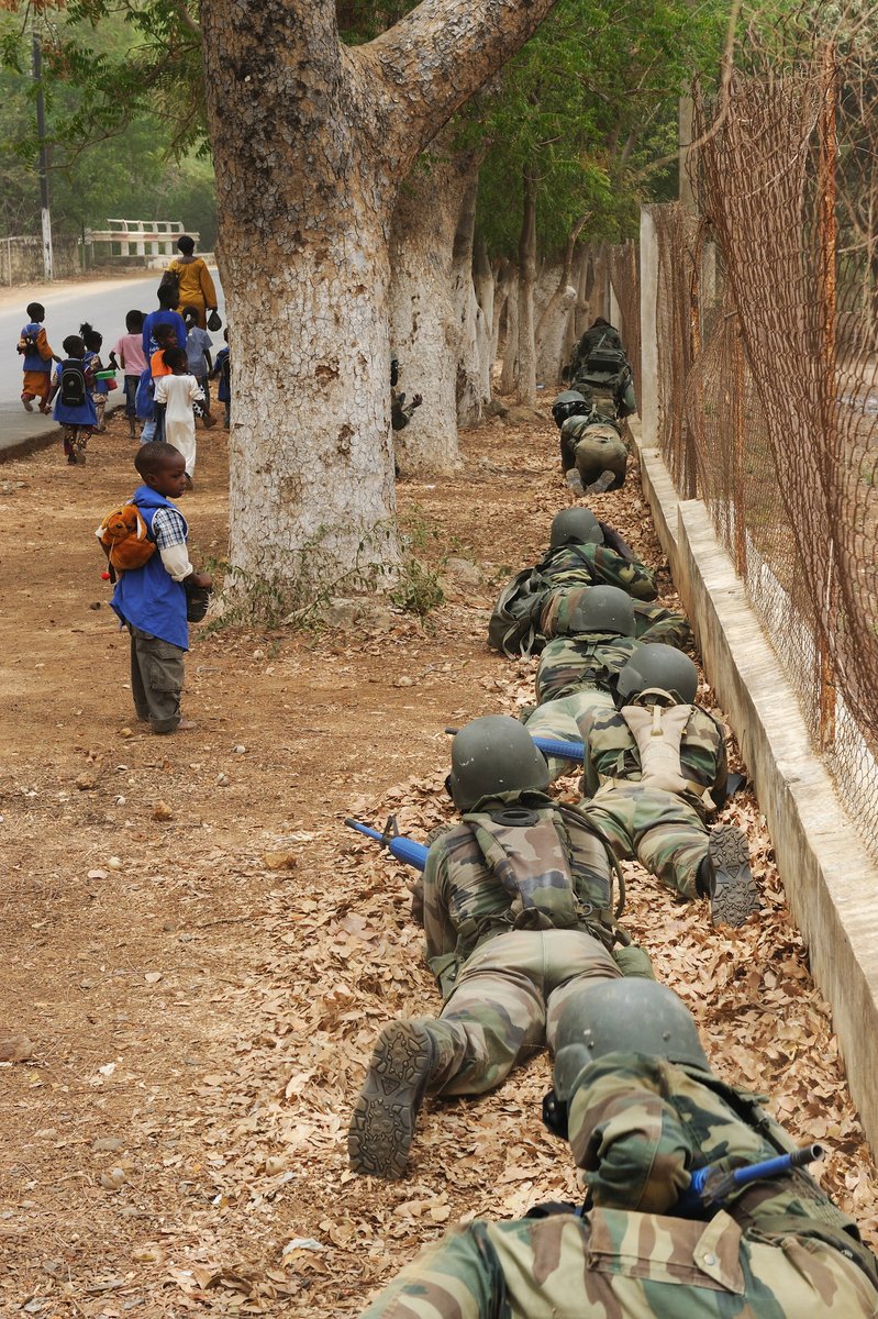 SOAAorg's tweet image. Schoolchildren look on as a Senegalese counterterrorism team maneuvers through an area while performing patrolling rehearsals in Theis, Senegal, May 14, 2010, as part of exercise Flintlock 2010. The military training engagement, which was led by U.S. Marines from U.S. Marine…