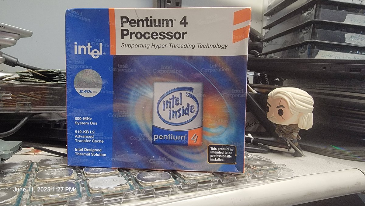 BlueStarTom's tweet photo. Found a new sealed Pentium 4 CPU today (The Witcher is standing guard lol) https://t.co/MbnSNeGUYl