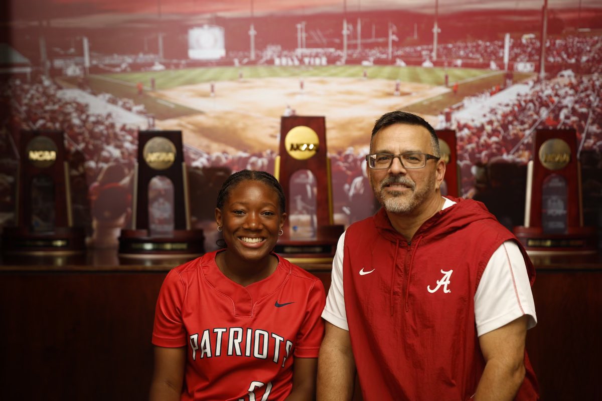 Kennedy representing BJ Softball in Tuscaloosa with Coach Murph.