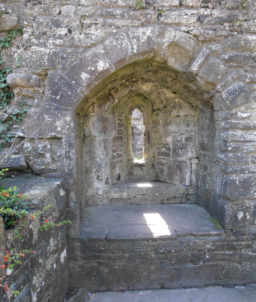 From the archives.  
Sunshine through a tiny window in the castle at Abergavenny, lighting up the grey stonework.