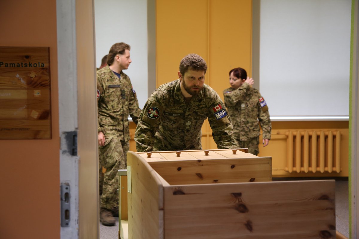 CanadaLatvia's tweet photo. 💙On June 5, Op REASSURANCE @TFL_FOL MPU Det presented a €2,783.86 donation to Strazdumuiza School for the Blind in Riga, raised by recycling 15,000+ bottles. Amb.@BrianSzwarc &amp; Col Sauvé joined the celebration of community, reflecting the strong ties 🇨🇦 continues to build in 🇱🇻 https://t.co/m8JjrjfHEb