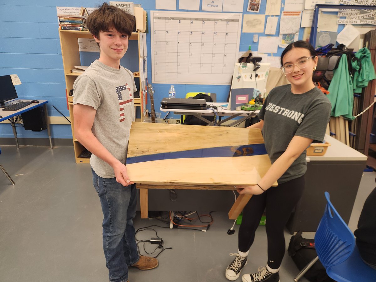 Students Cullen Lewis &amp; Riley Vrana combined their skills in manufacturing &amp; art to create this impressive table for the SPMS office. They designed the table, manufactured all the pieces, poured the resin, assembled &amp; wired it with lights for an added touch of elegance. #SPSoars