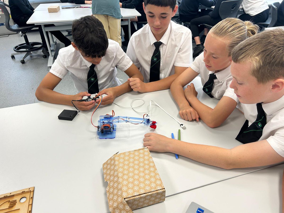 Year 7 pupils at Renishaw engineering busy creating operation robots!