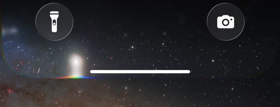 A Liquid Glass overlay on a starry sky backdrop. The overlay is bending and refracting the light of a star into a rainbow, similarly to how a real-life prism behaves